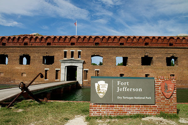 Fort Jefferson stands majestically at Dry Tortugas National Park, showcasing its historic brick structure against a clear blue sky.