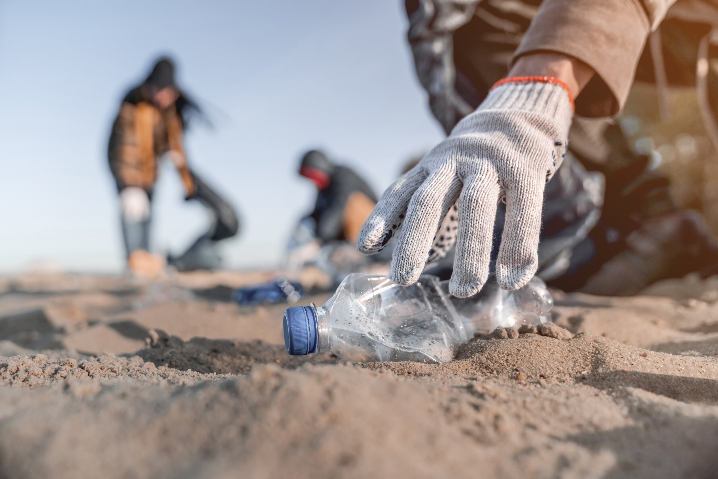 a beach cleanup, plastic bottle