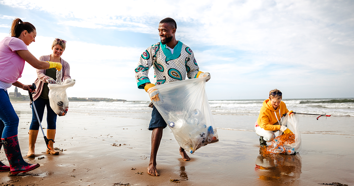 a beach cleanup, people having fun