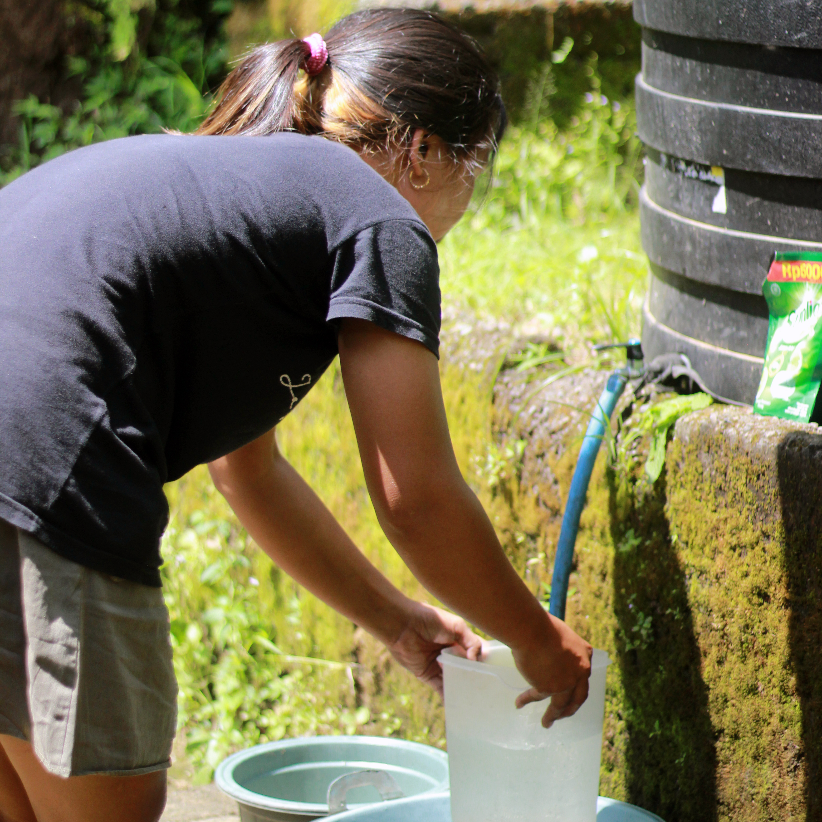 A woman collecting water