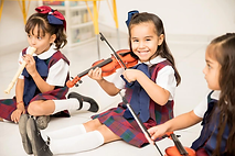 portrait-cute-latin-girl-learning-how-play-violin-having-fun-preschool_662251-2637.webp