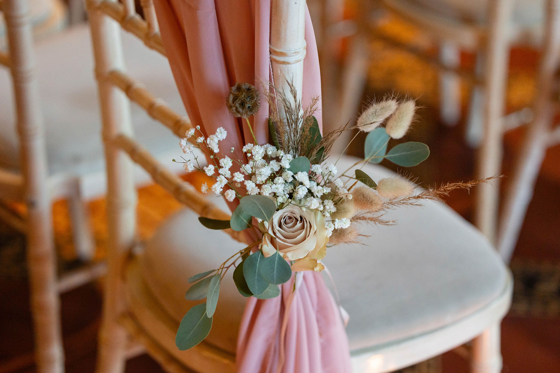 Close up of flower detail in ceremony room at Peckforton Castle. Taken by relaxed wedding photographer, Nicki Jones Photography.