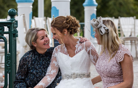 Candid photo of the Bride with her friends during her drinks reception laughing and having fun. Captured by Shropshire candid wedding photographer - Nicki Jones Photography.