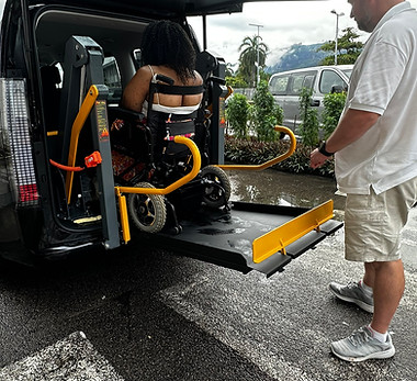 A wheelchair bound passenger entering the vehicle from the lift