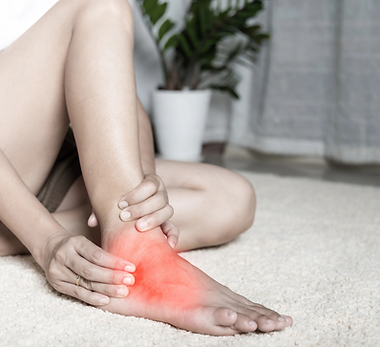 woman-with-top-of-foot-pain-holding-foot-chardon-ohio.png