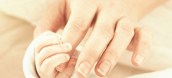 Holding Baby's Hand_edited_edited.jpg