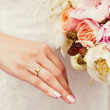 A small hand-held bouquet of fresh seasonal blooms from Apple & Dove Flower Co. 