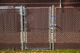 Chain link Gate and fencing for a utility enclosure with privacy slats
