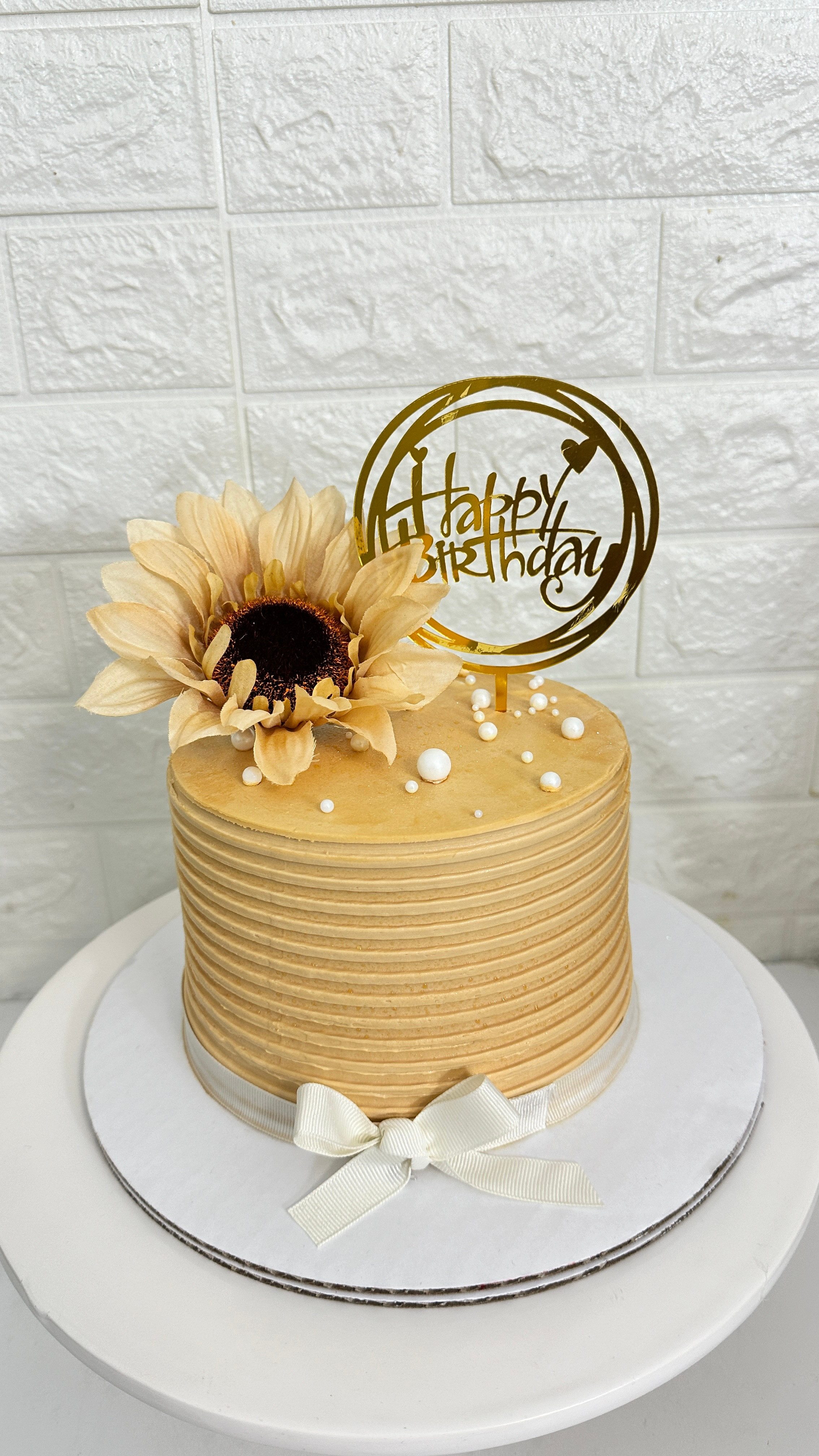 Beige sunflower cake