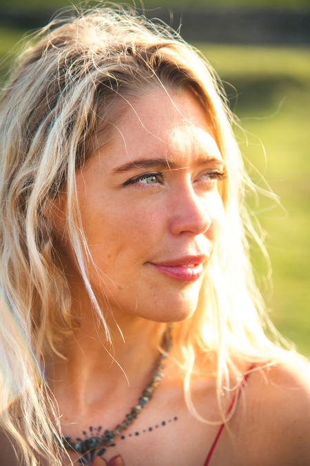 Wellness practitioner Mary and the Elements sitting in the sun near Roman ruins in Oxfordshire - Emily Dyer Wellness Brand Photography