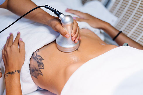 body cavitation procedure, the device is held onto a women's stomach