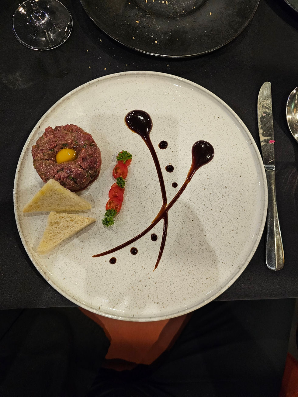 Elegant plated gourmet dish with artistic sauce presentation