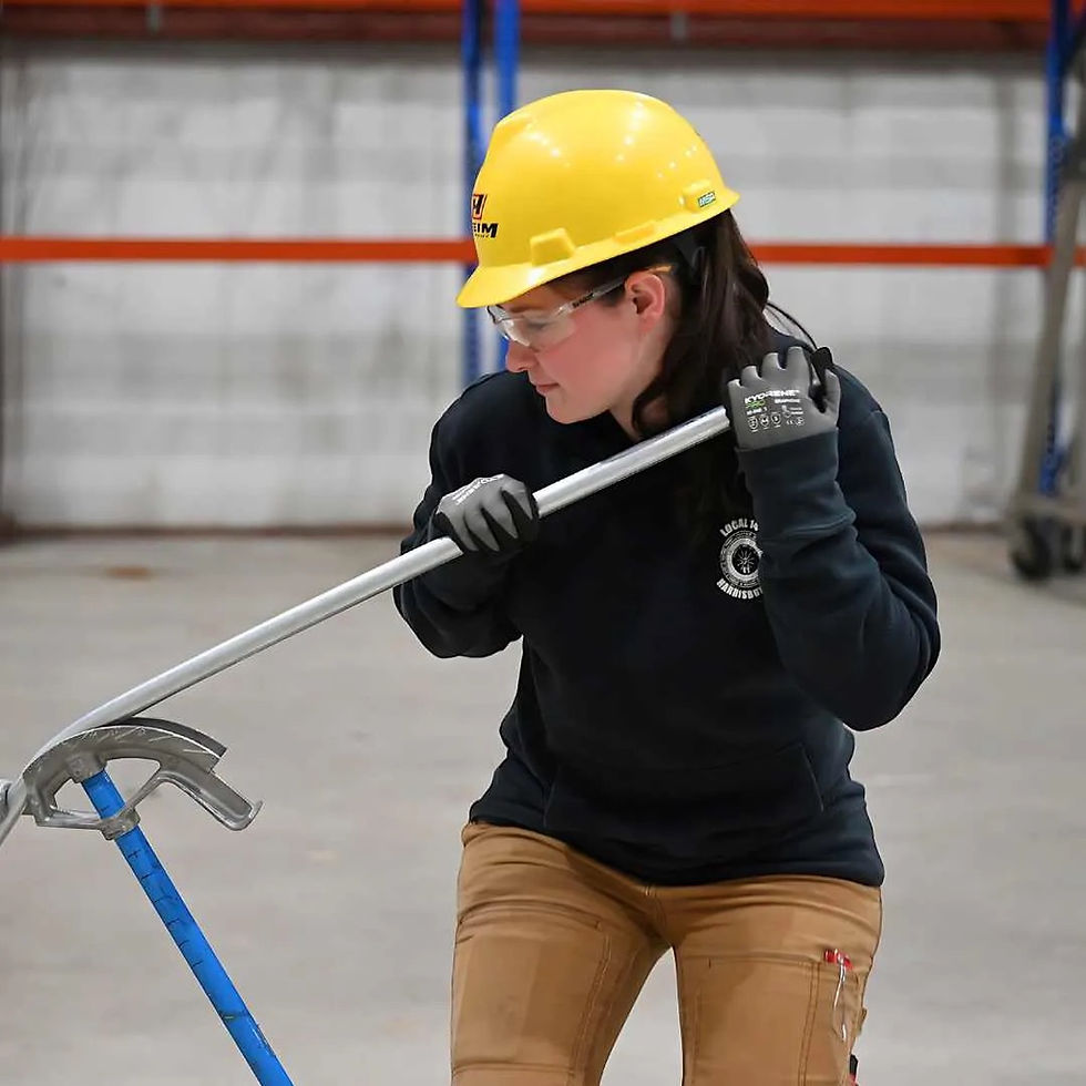 worker bending metal conduit