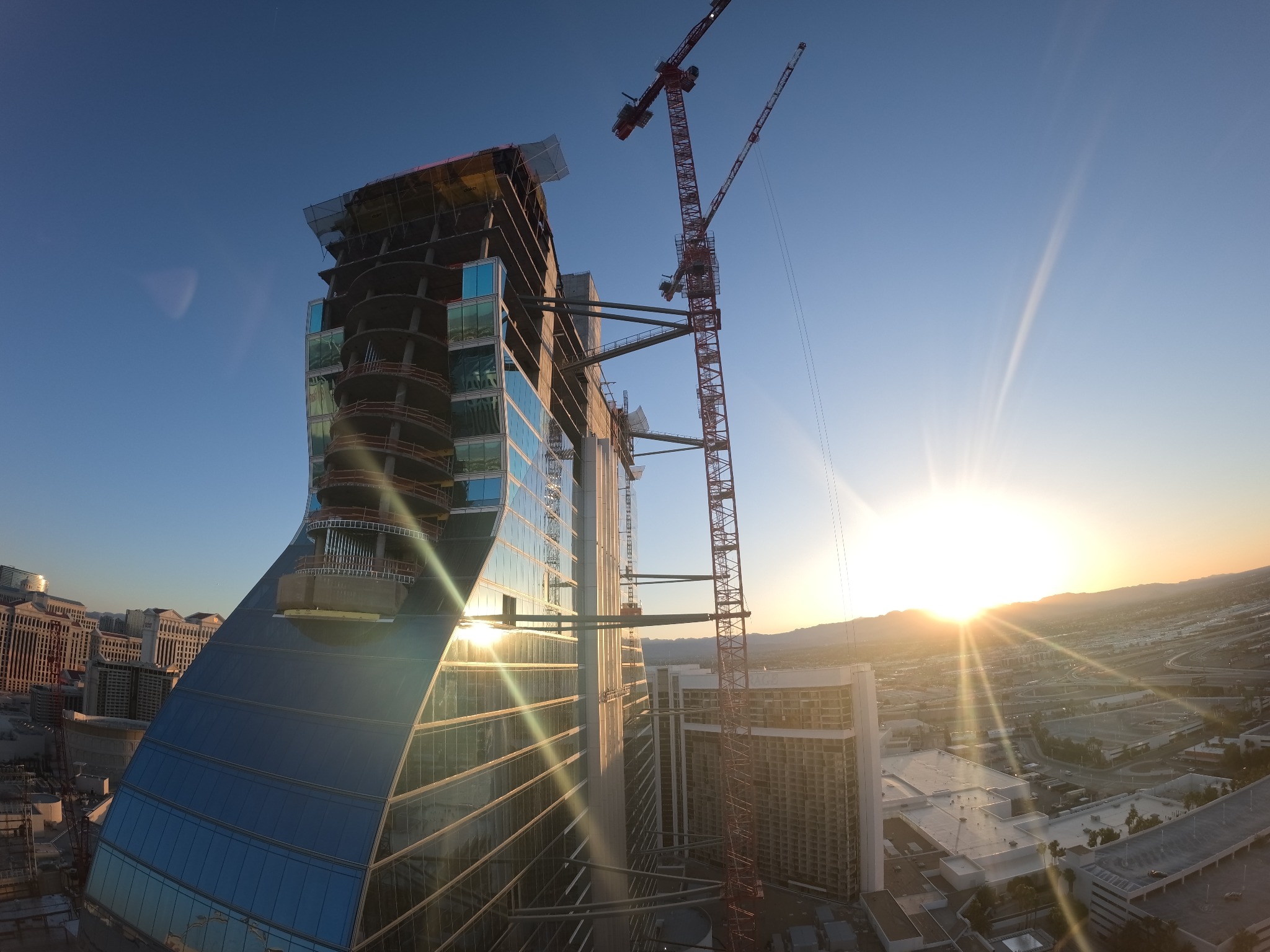 Hard Rock construction and cranes above Las Vegas in golden sunlight
