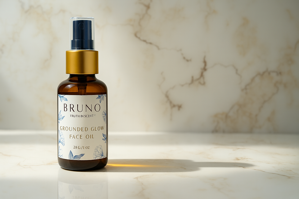 Close-up view of a glass bottle with golden facial oil on a marble surface