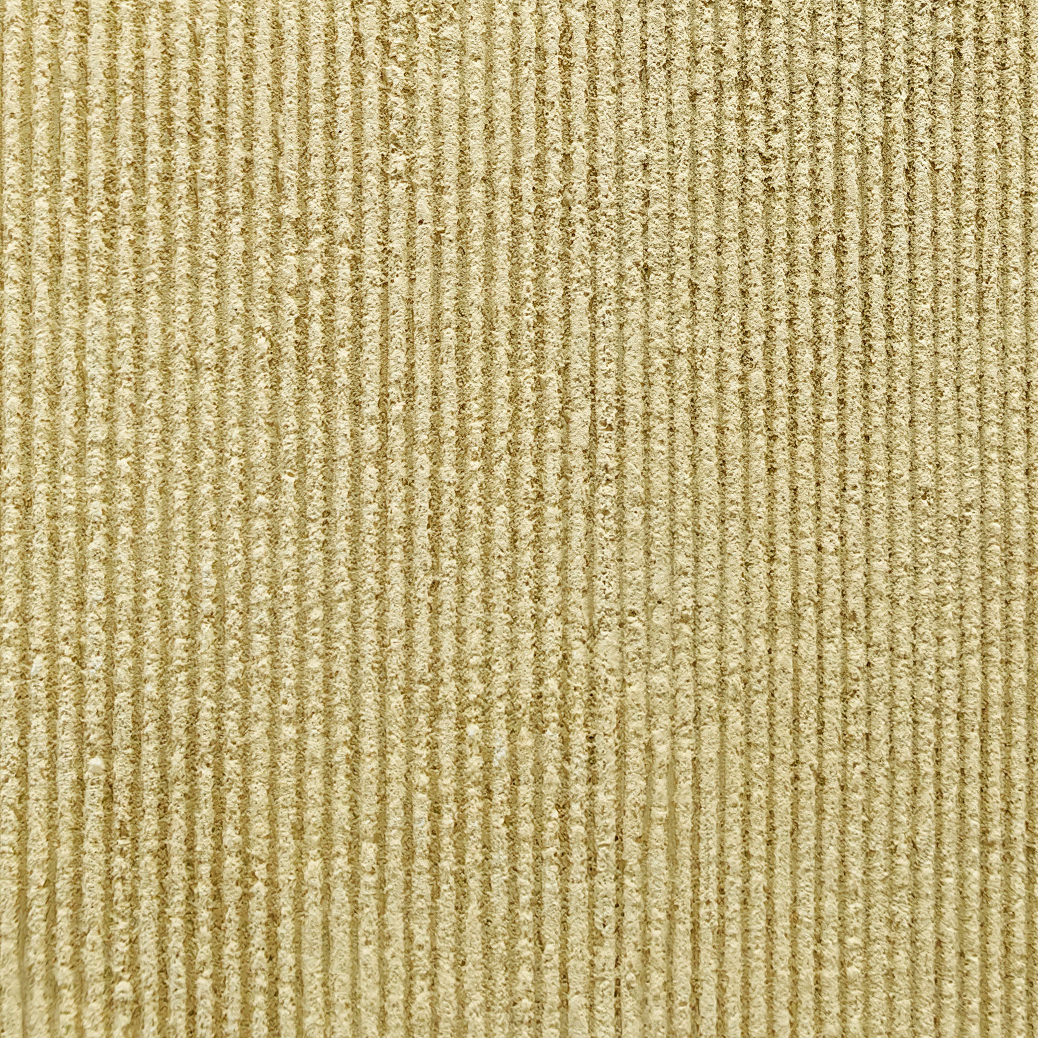 Textured soft stone surface showing closely spaced ripples and fine porous details in neutral tone.