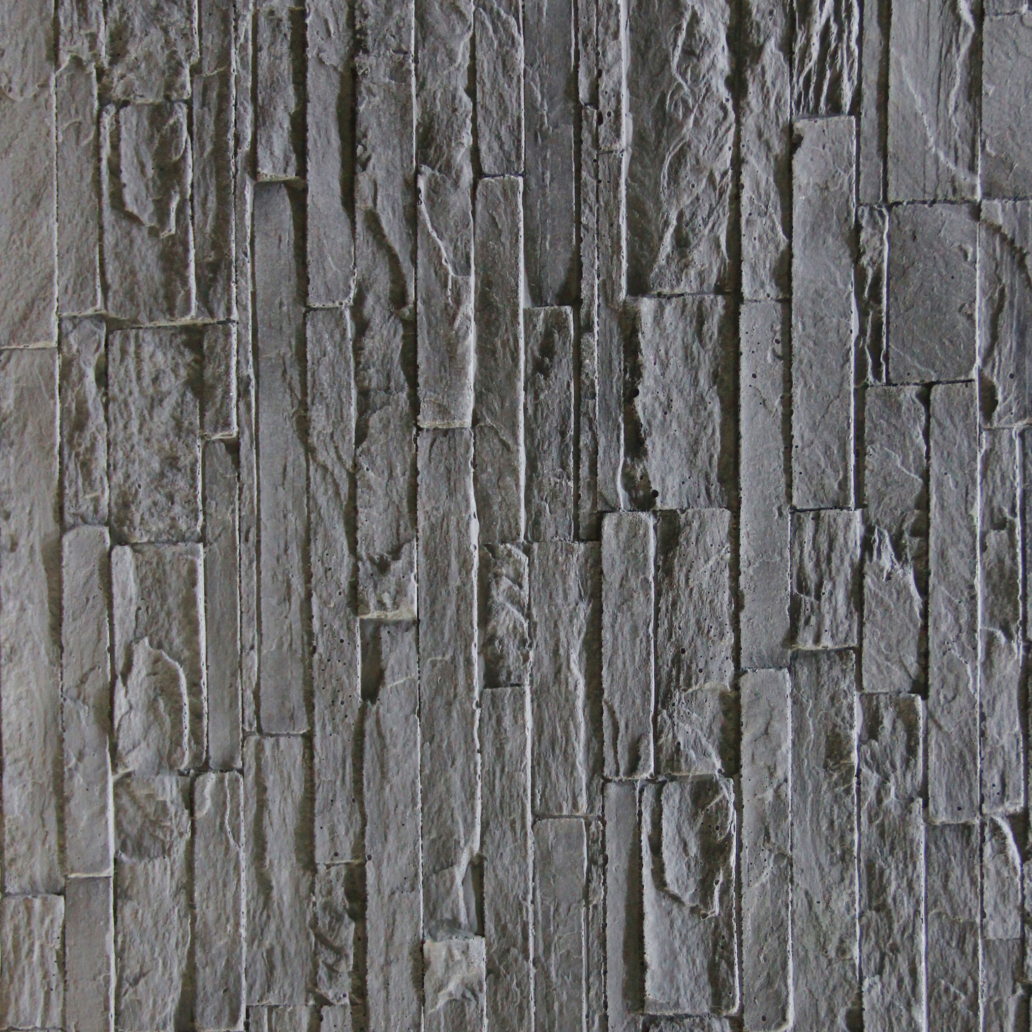 Close-up of STONIKO Piled Stone showing detailed texture and overlapping stone shapes.