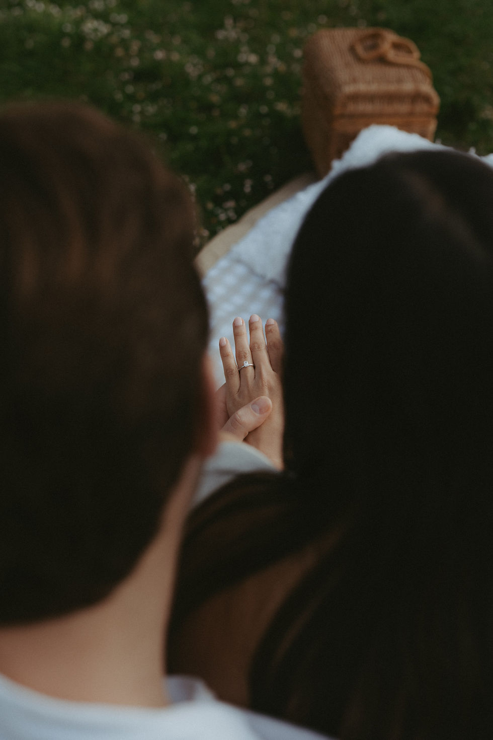 The roman style pillars stood tall above an elegant picnic set up ready for a proposal. 