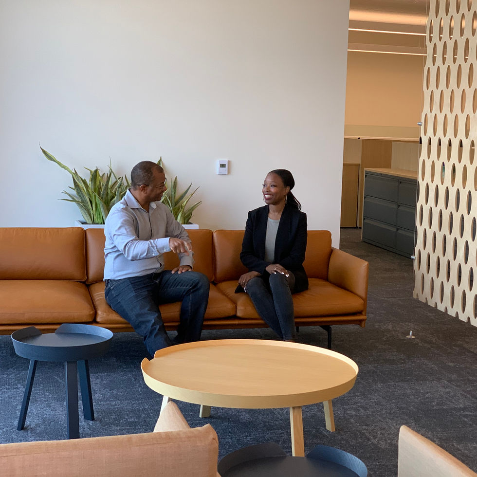 Two friends and collegues enjoying each other on a couch