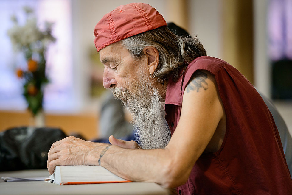 One man reads the Bible at the Bridge Ministry day shelter in Cincinnati, Ohio