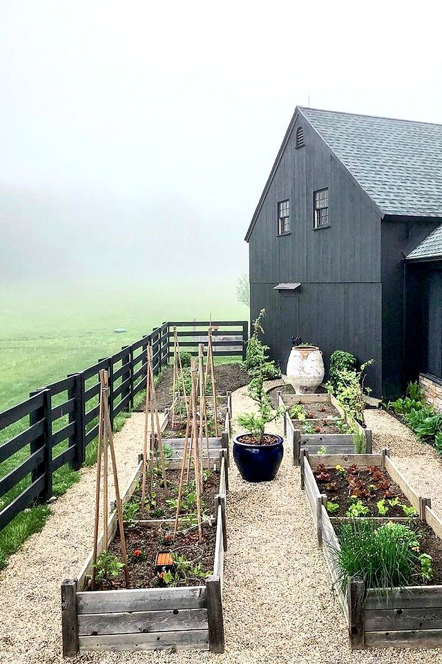 black barn with edible garden