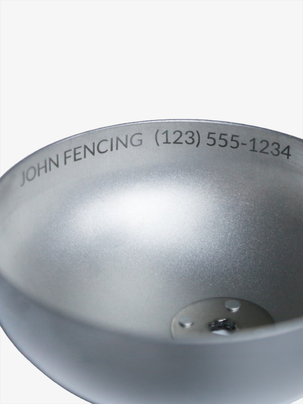 Close-up of epee guard engraving with sample name and phone number on silver guard