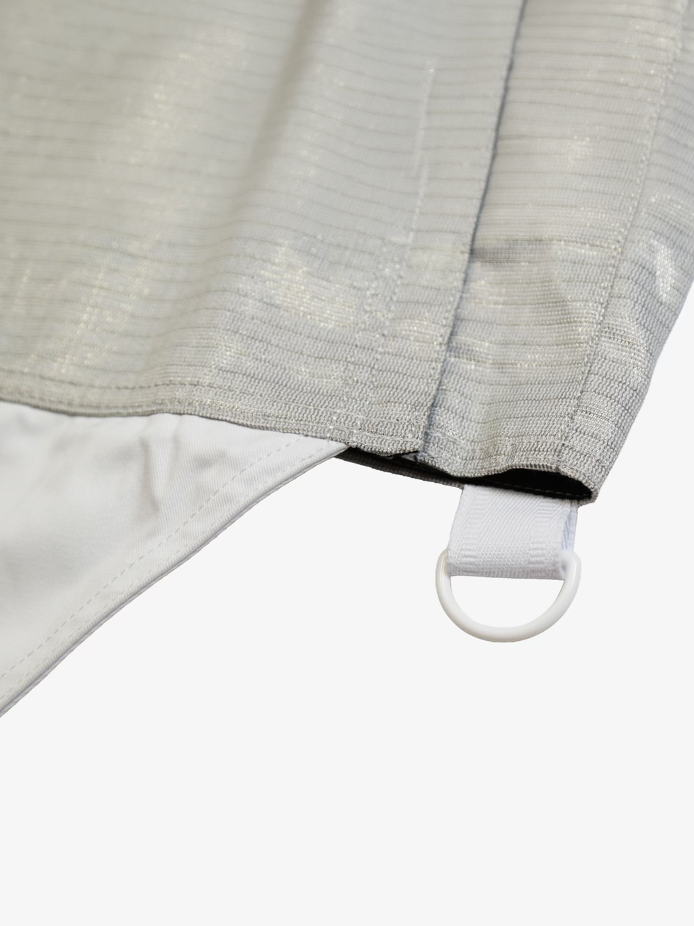 Ferre Kids Sabre Lame close-up showing lower hem, conductive fabric, and attachment loop