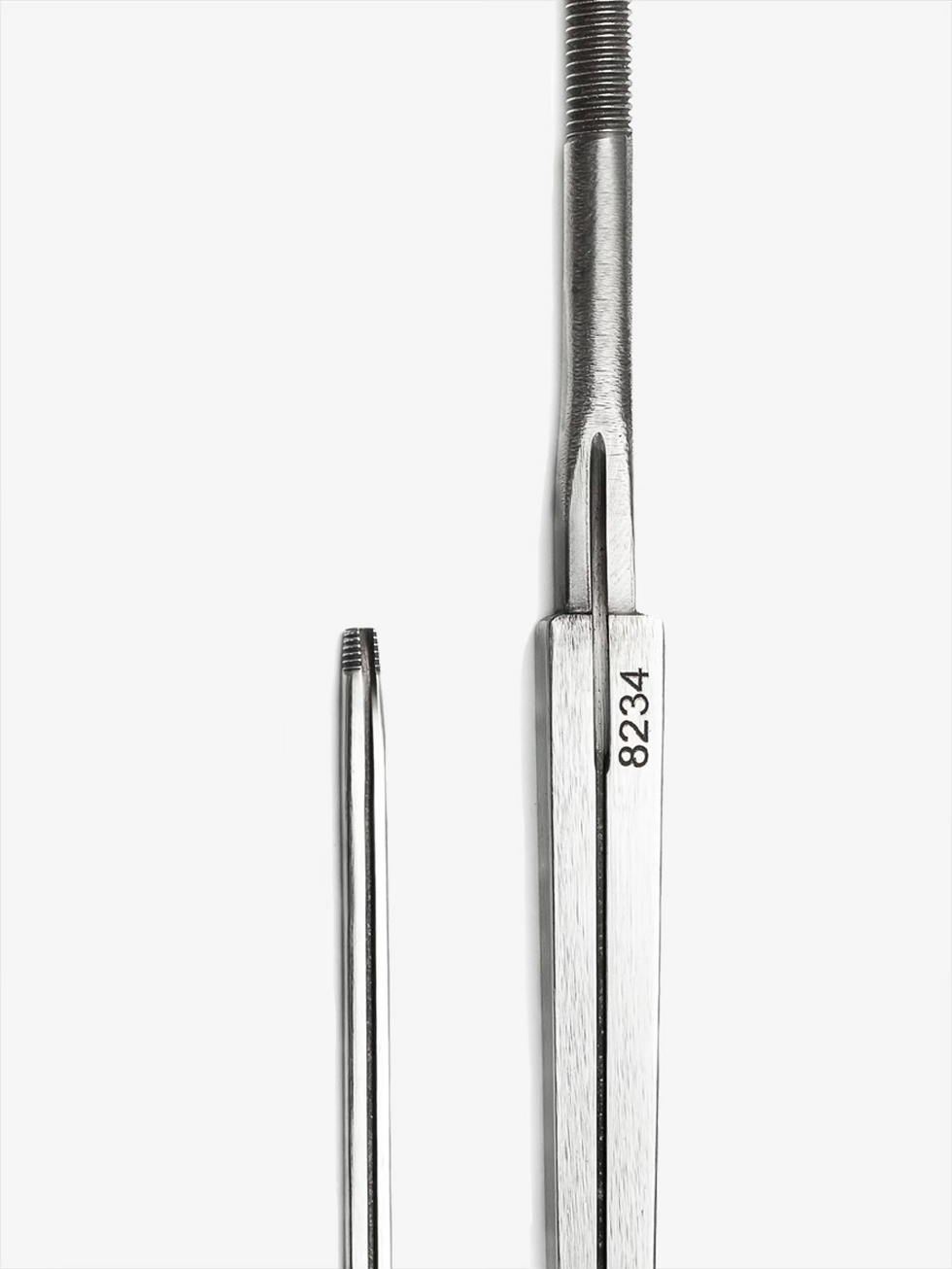 Unic Foil FIE Blade close-up showing wired groove, tang, serial number, and polished steel finish