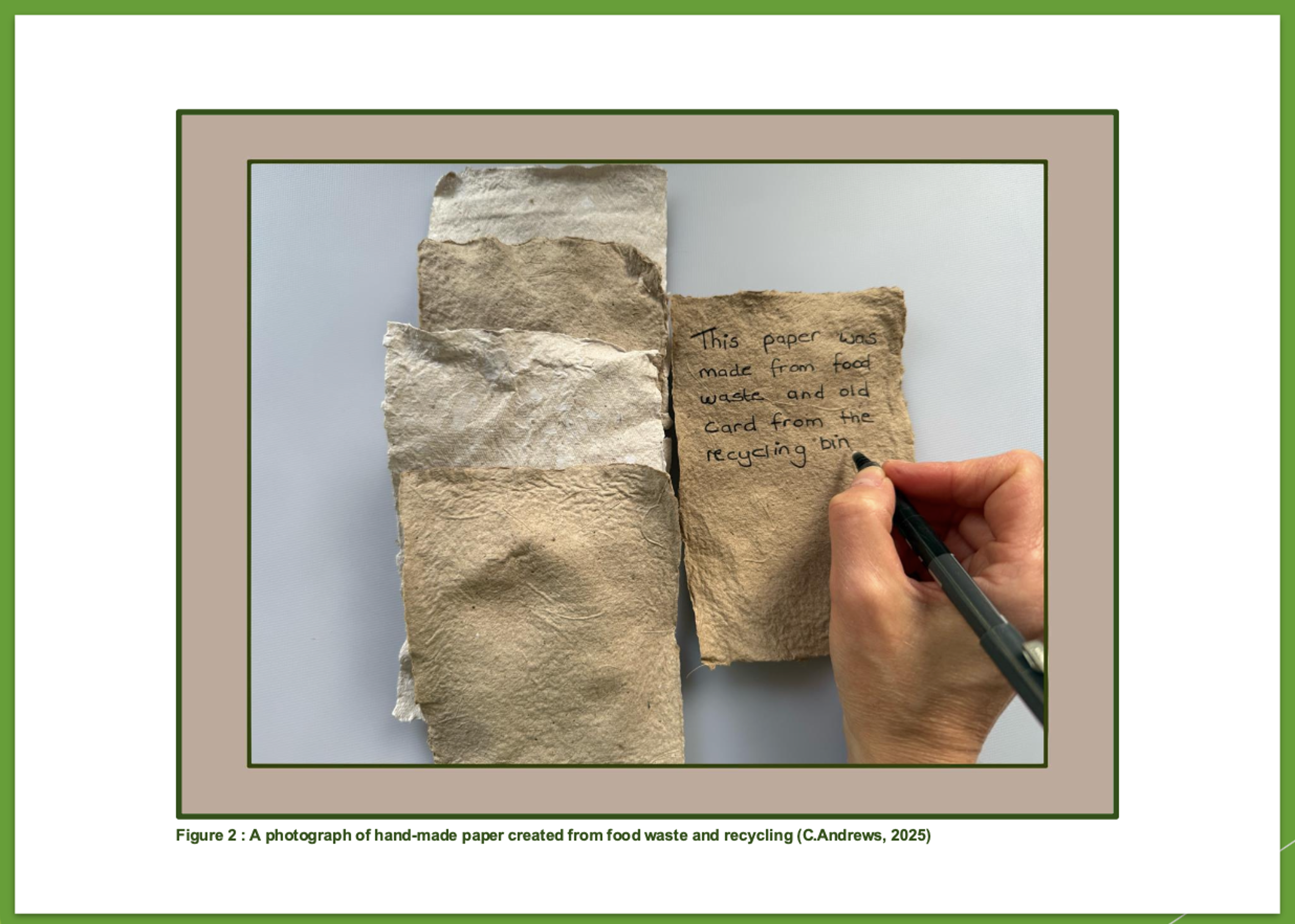 Hands writing on handmade paper from food waste and recycling