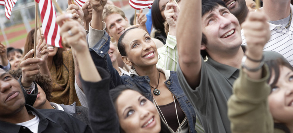 People waving American flags