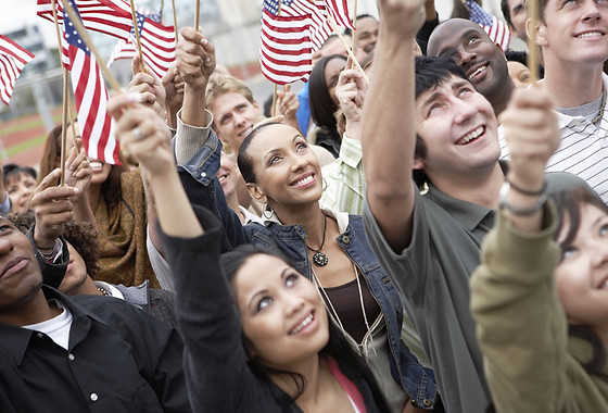 People waving American flags