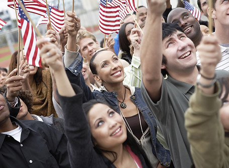 People waving American flags