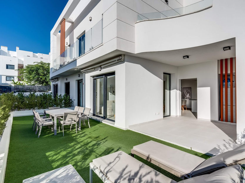Exterior of modern Bel Air townhouse with private garden and sunlit terrace area