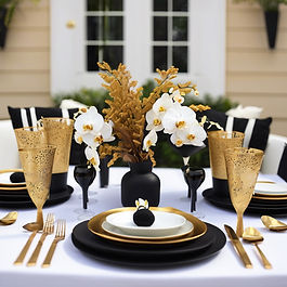 Outdoor table setting of black and gold and white for a place setting for 8 places, with o