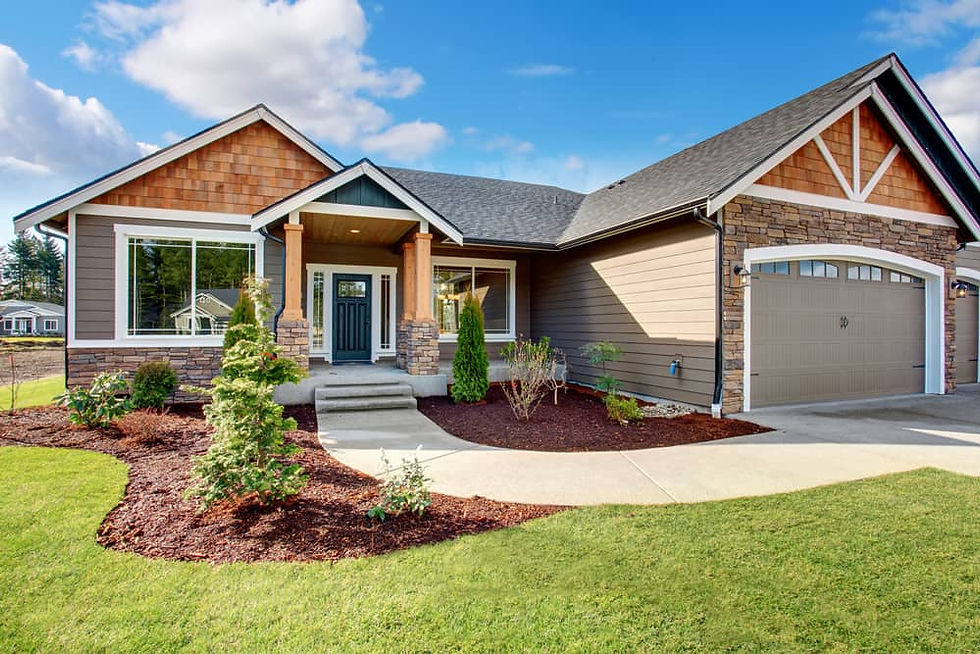 tan one story house with cedar shakes in the eaves