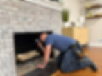 Anthony inspecting fireplace.jpg