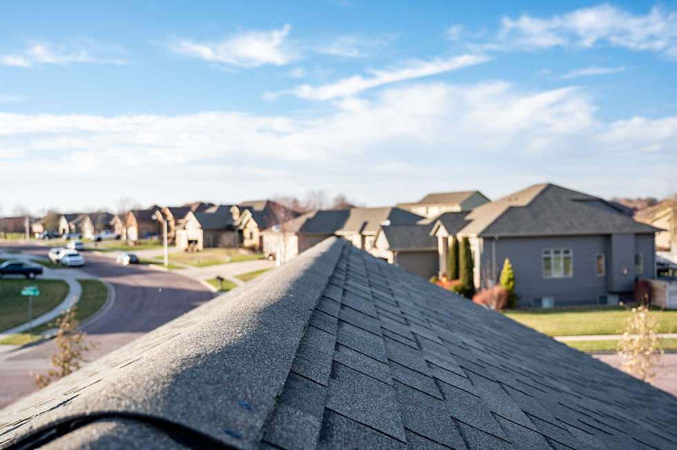 view of roof looking over a neighborhood