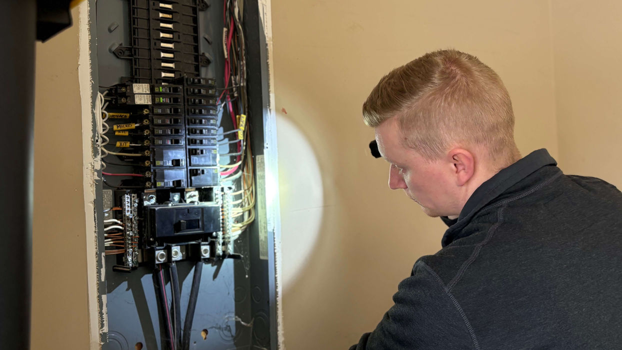 Jeremiah inspecting electrical panel
