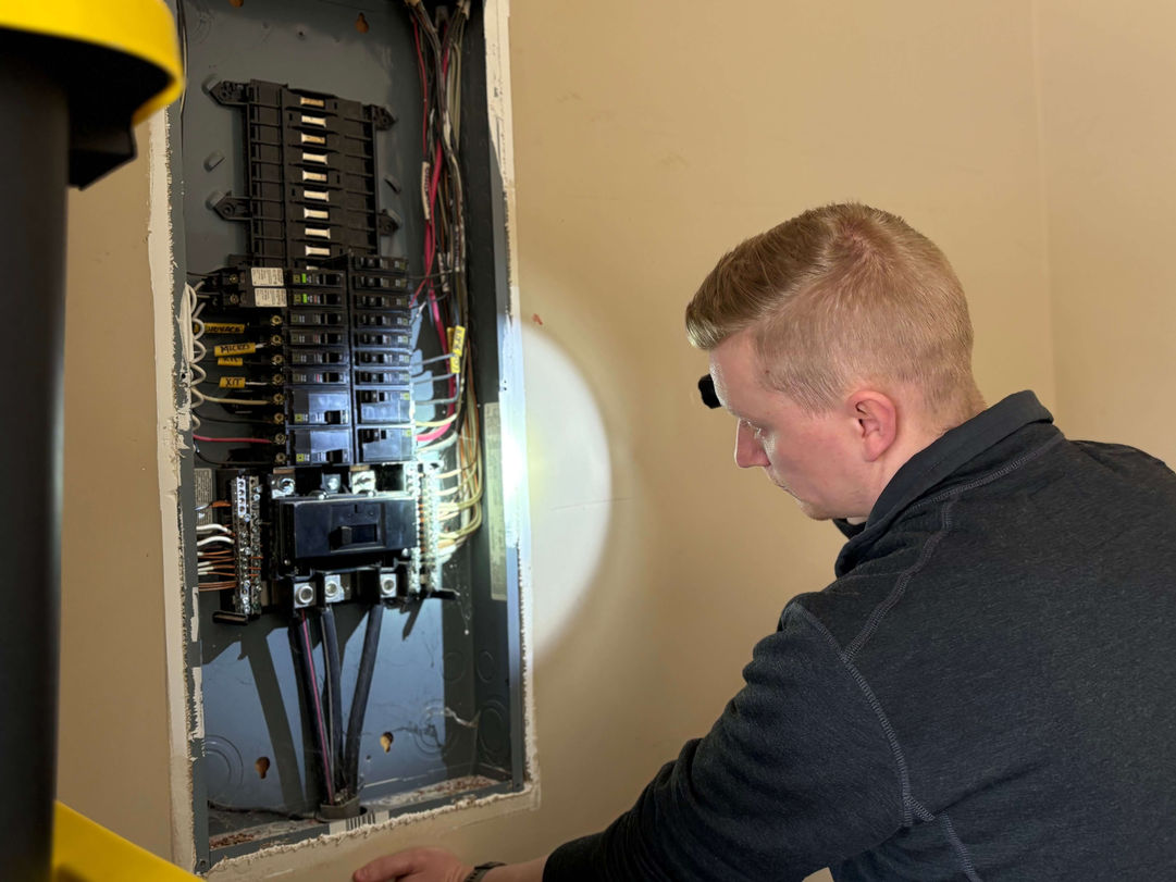 Jeremiah inspecting electrical panel