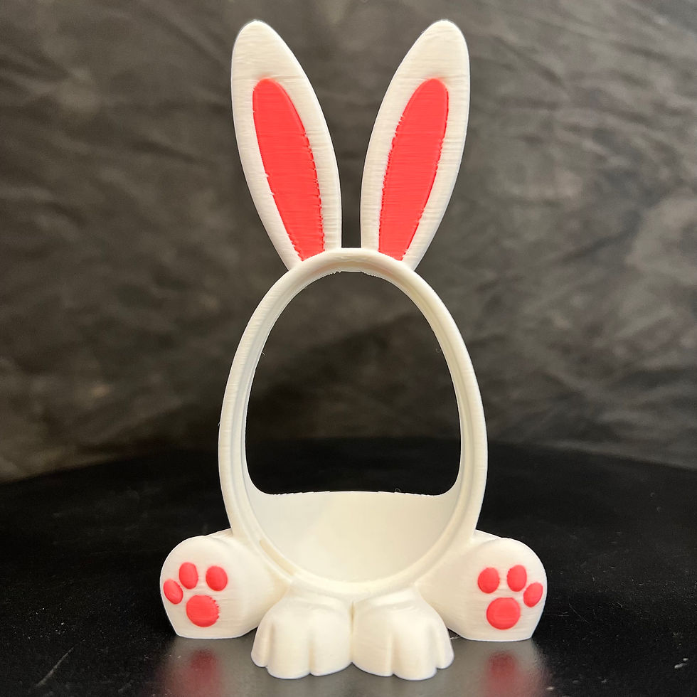 Thumbnail: Whimsical Easter Bunny 3D printed Kinder Egg novelty holder with multicolor accents and an egg-shaped cutout for treats