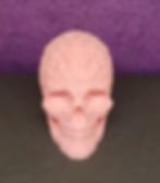 3D printed skull completely covered in blooming roses