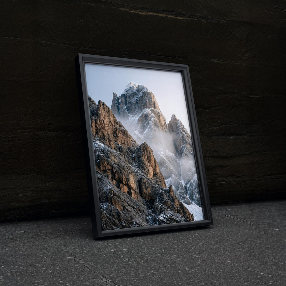 Majestic mountain art print with snow-dusted peaks and mist drifting through rocky cliffs.