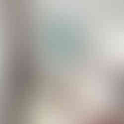 Illustration of two bullfinches sitting on branches surrounded by white and pink flowers against a teal background.