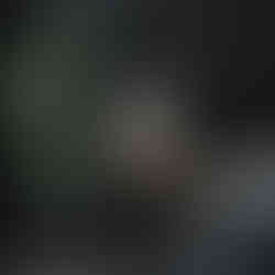 Abstract silhouette of a woman in a beige dress with soft curved background shapes in neutral tones.