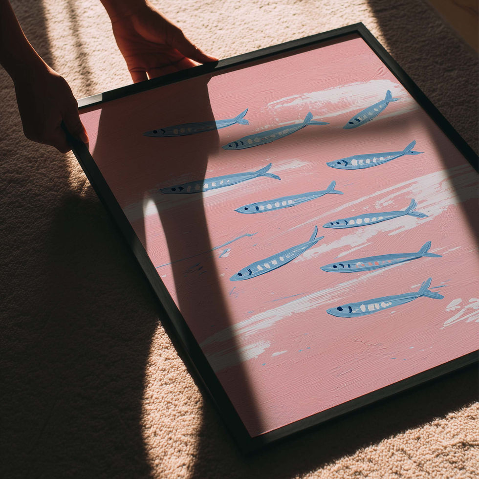 Modern art print of a shoal of blue fish on a soft pink background.