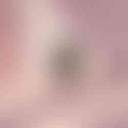 Abstract wall art with dramatic black and gold paint streaks over white.