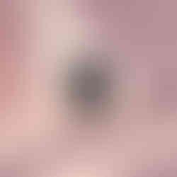 Black and white image of a dog reading a newspaper while sitting on a toilet