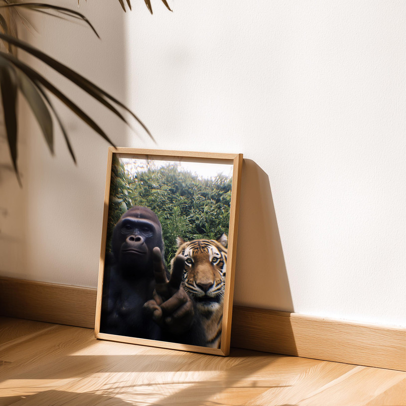 Humorous wildlife art print of a gorilla giving a peace sign next to a tiger posing for a selfie.