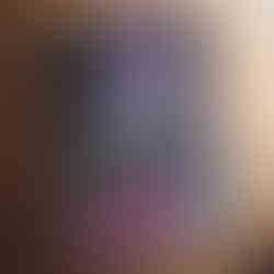 Graffiti-style artwork of an astronaut sitting on steps with pink paint splashes and a cosmic space background.