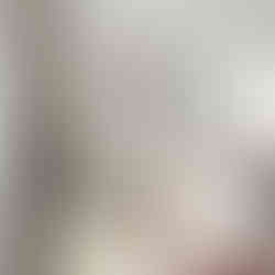 Smiling giraffe wearing flower-filled sunglasses on a white background.